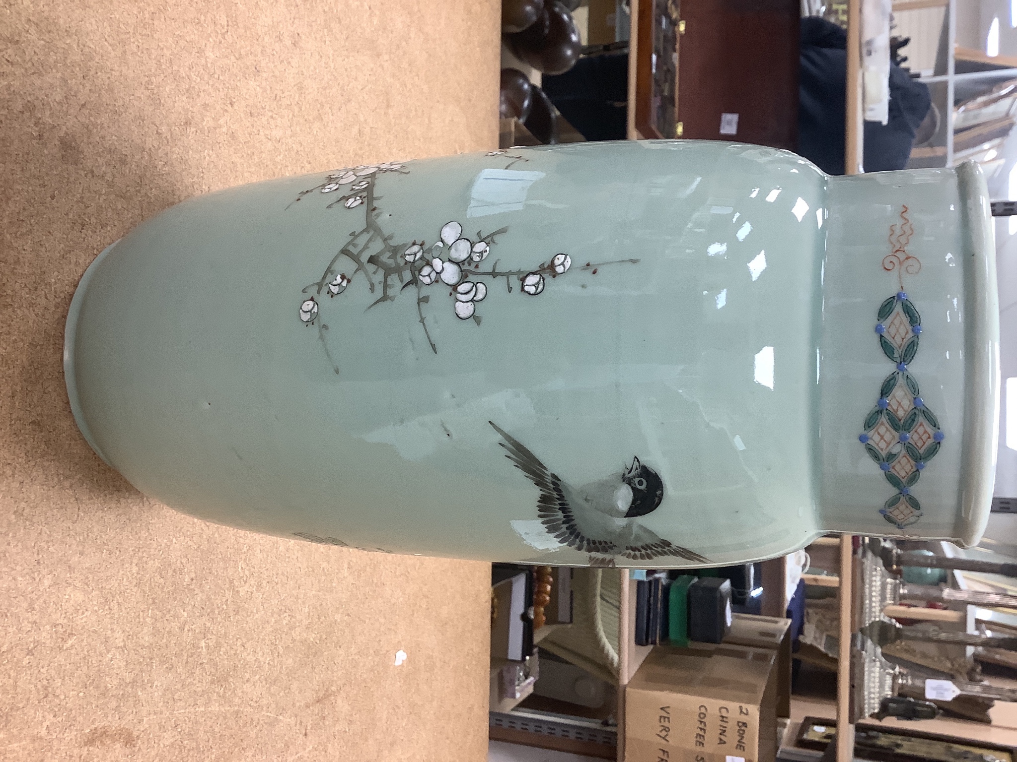 A pair of 19th century Japanese celadon glazed vases (drilled) with hardwood stands, total height 31cm